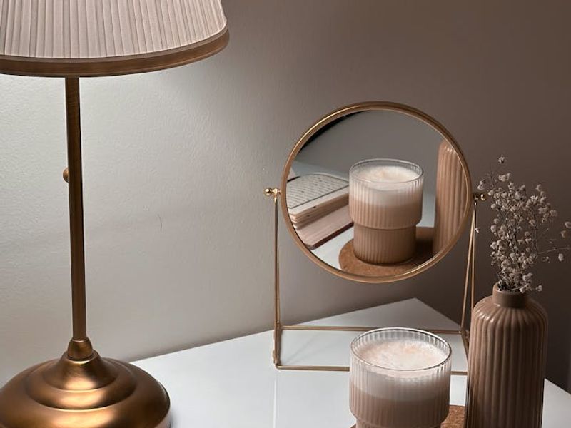 Minimalist desk with a book and soft ambient lighting.